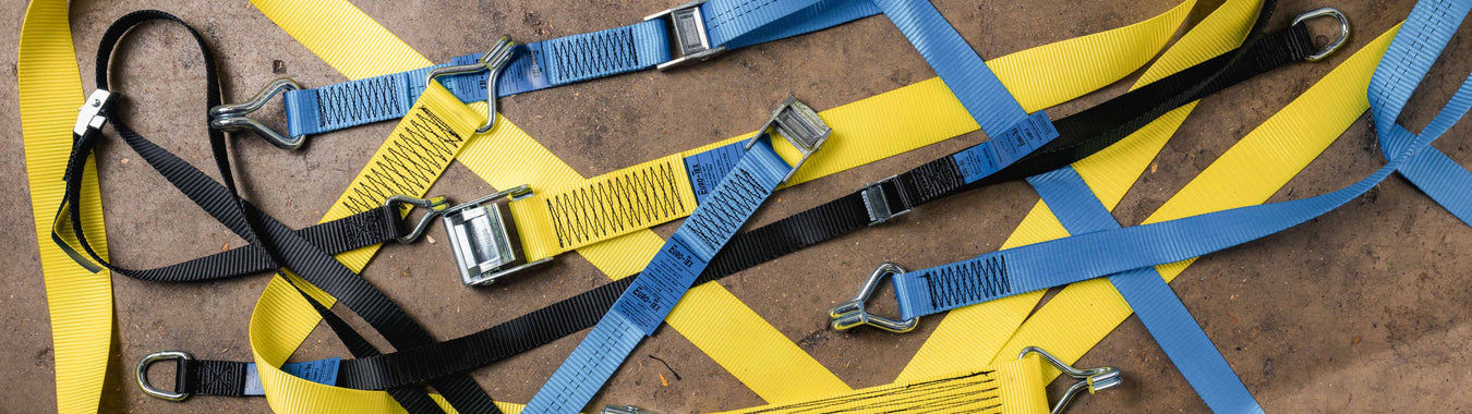 thin orange taut strap fastened with a silver buckle